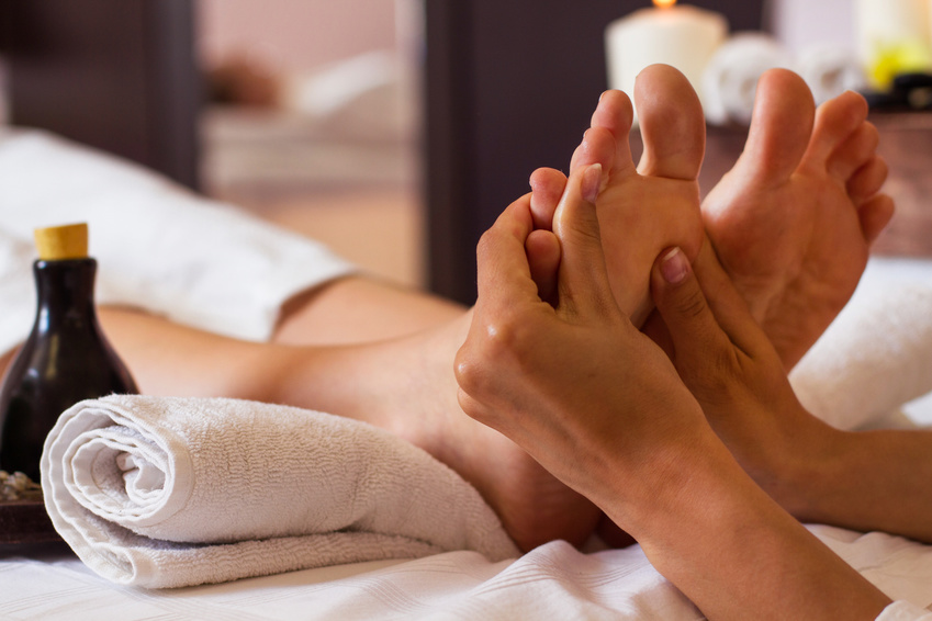 Massage of human foot in spa salon - Soft focus image
